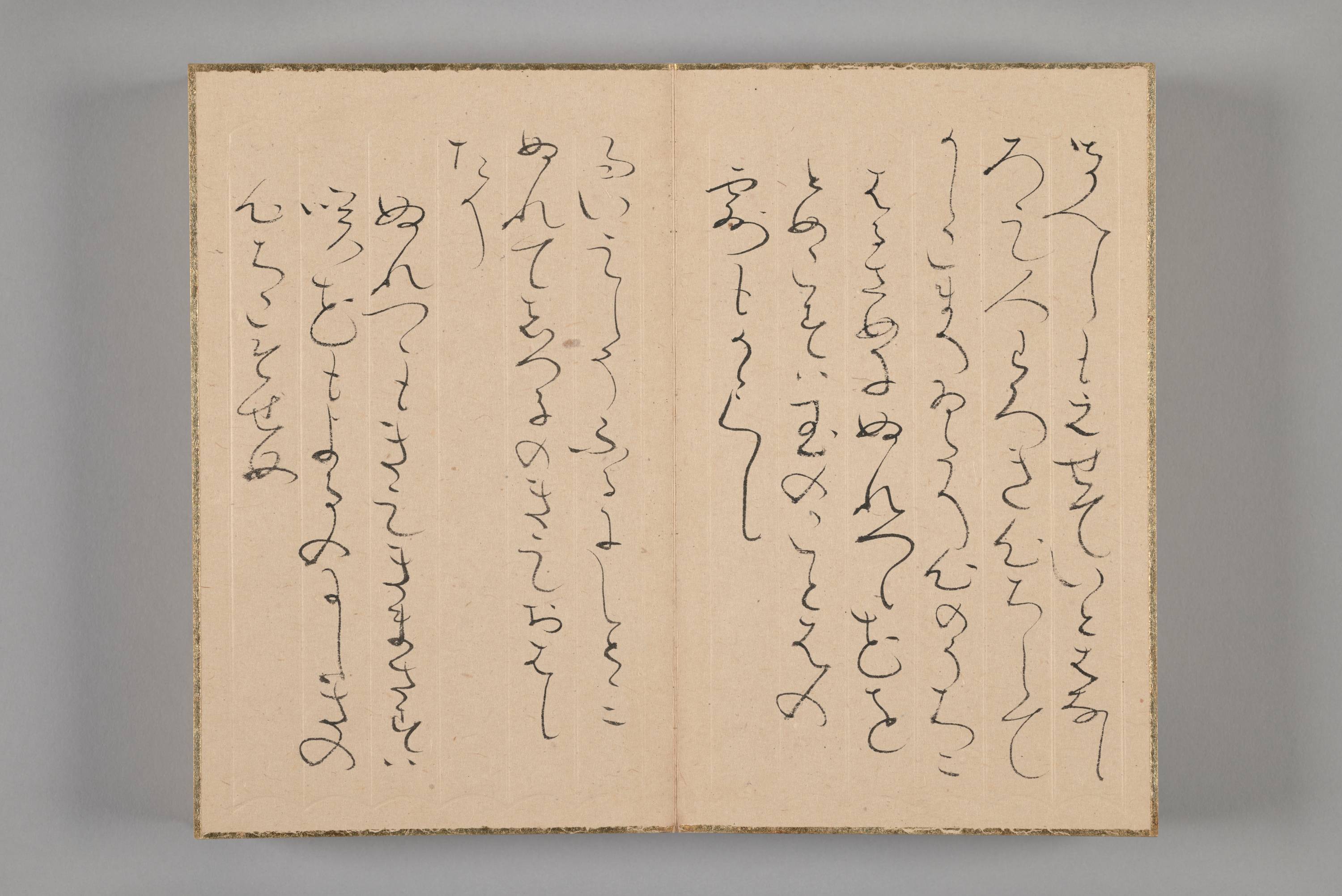 Two-page spread of a bound album with several vertical lines of cursive.